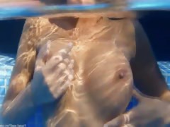 Underwater strip of bewitching boobs