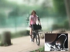 Asian teen sweeties riding bikes with dildos in their cunts