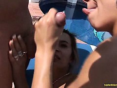 Blonde gives a nice blowjob by the pool