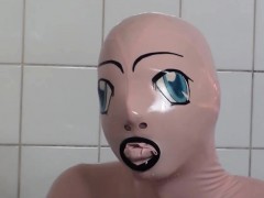 Tanja takes a bath in her latex sex doll costume