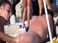 Naked couple on public beach