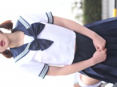 Sexy Asian chick in a schoolgirl outfit loves to tease the 