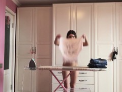 Ironing the kinky clothes while completely naked
