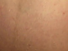 Pregnant mature woman is taking a bath while her