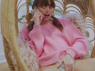 Brunette female in pink sweater likes a phone kink