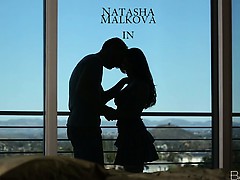 Natasha and her lover share an intimate moment of