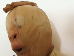 Wicked blond-haired distorted nylon mask face