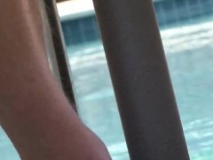 Tommy kicks back by the pool and strokes his hard man's wood