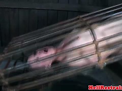 Caged submissive in drowning fetish