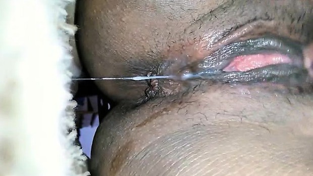 Black babe masturbates and squirts - closeup