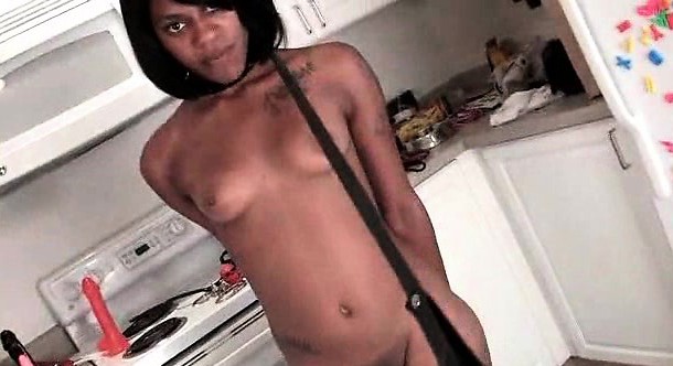 Naked ebony tied sex slave pissing in a glass