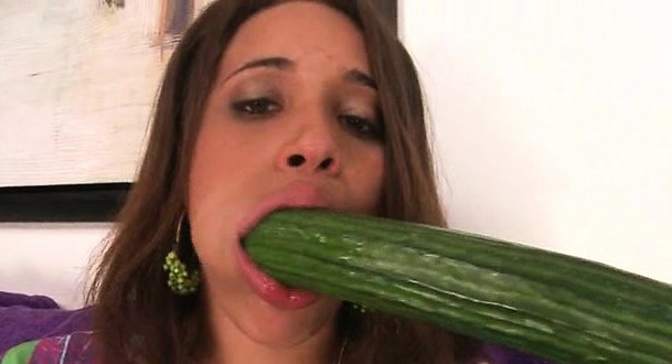 Nasty teen sucking two large cucumbers at once