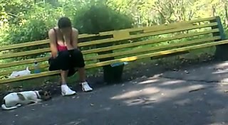 He films a gal sitting on a bench and has his dick out whil