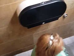 Spy cam in the bathroom catches a redhead sitting on the to