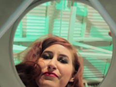 Redhead mistress teases sub with drops of pee
