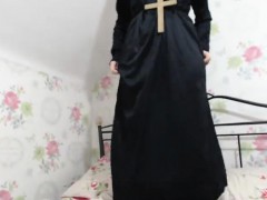 Sexy chick is dressed as a nun and teases to show a little 