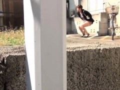 Asian urinates in street