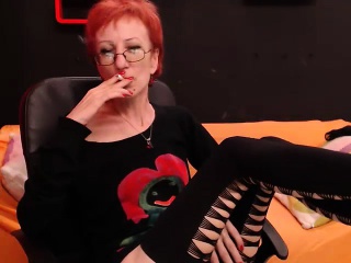 Hot Redhead Lady With Glasses Enjoys A Cigarette And Loses