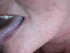 Sexy mature woman eating cum and licking dick