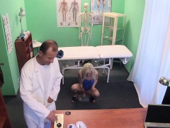 Doctor helping petite blonde patient to giving sample