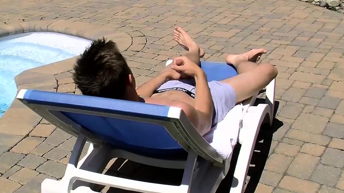 Jake Washington jerks off his dick by the swimming pool