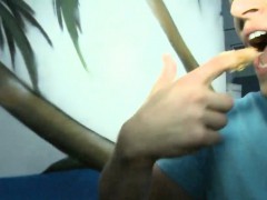 Blond babe sucks off hard cock thru gloryhole for money