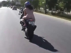 Naked woman on-bike