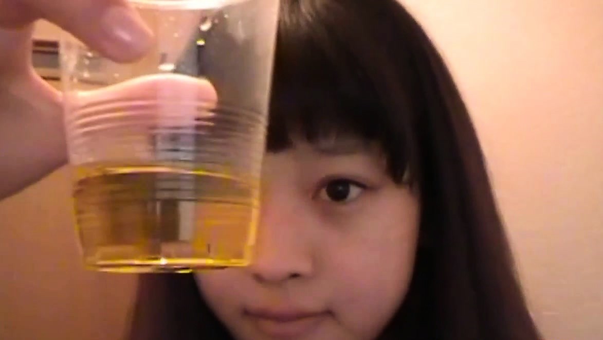 Asian teens piss in cup