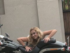 Hot girl on motorbike teases with her ass