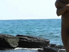 The pretty beach nudist babe