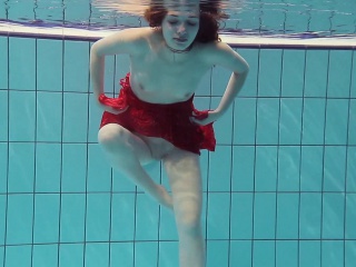 Red Dressed Teen Swimming With Her Eyes Opened