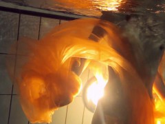 Yellow and Red clothed teen underwater