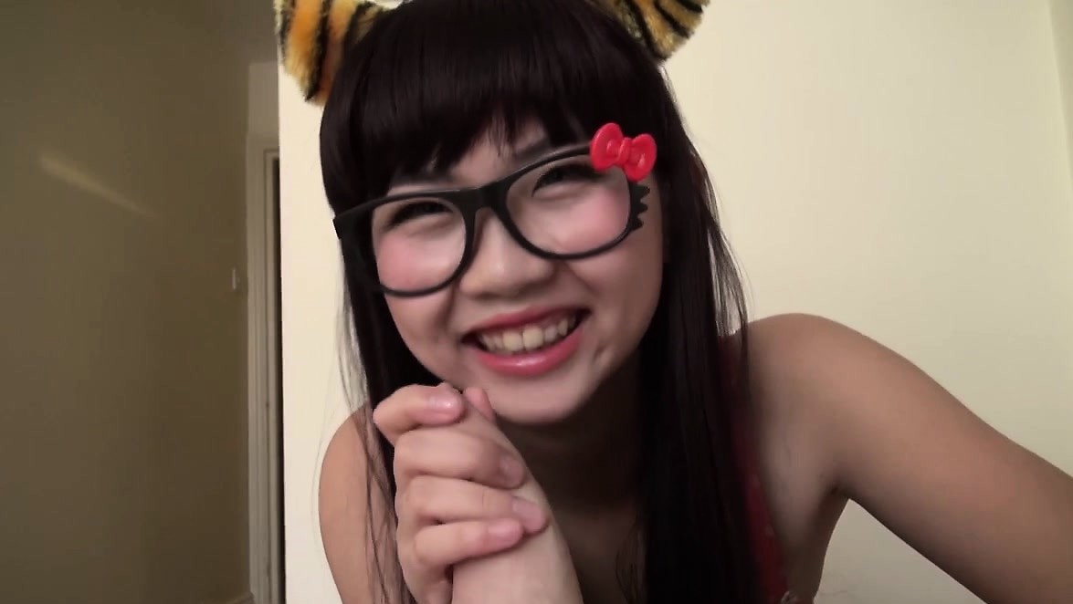 Asian teen gives a blowjob in tiger ears