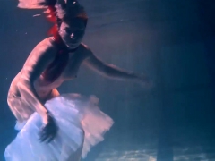 Bulava Lozhkova with a red tie and skirt underwater