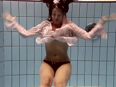 Sexy underwater teen swimming