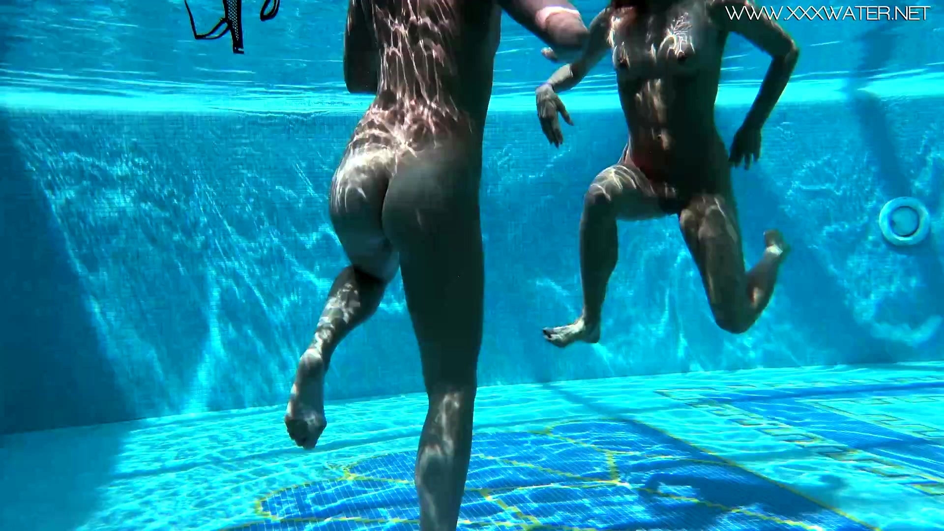 Jessica and Lindsay naked swimming in the pool