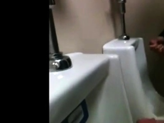 Two Slim Dicks Getting Wanked At The Urinals...