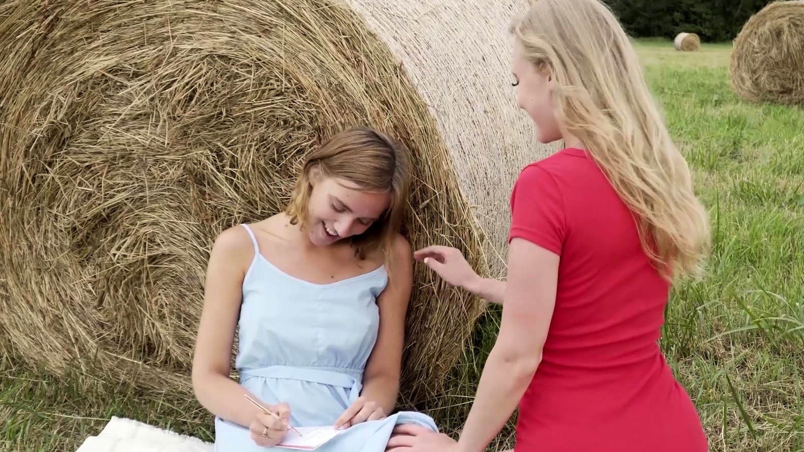 Oxana was hanging out in the hay field writing in her