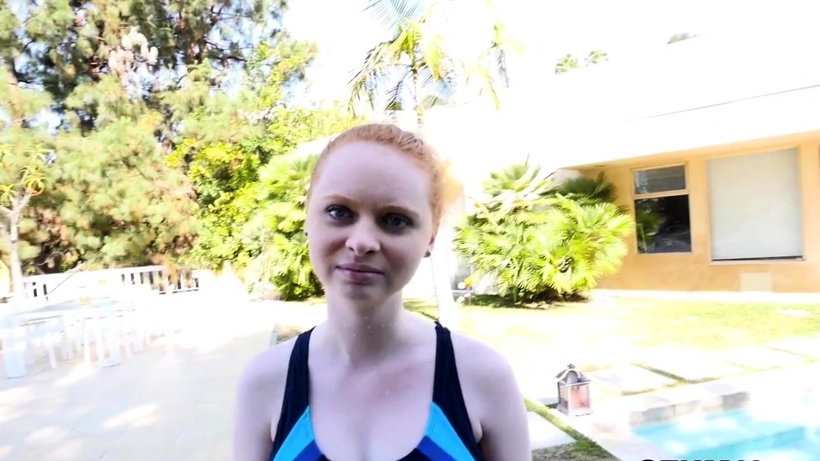 Teen redhead in swimsuit