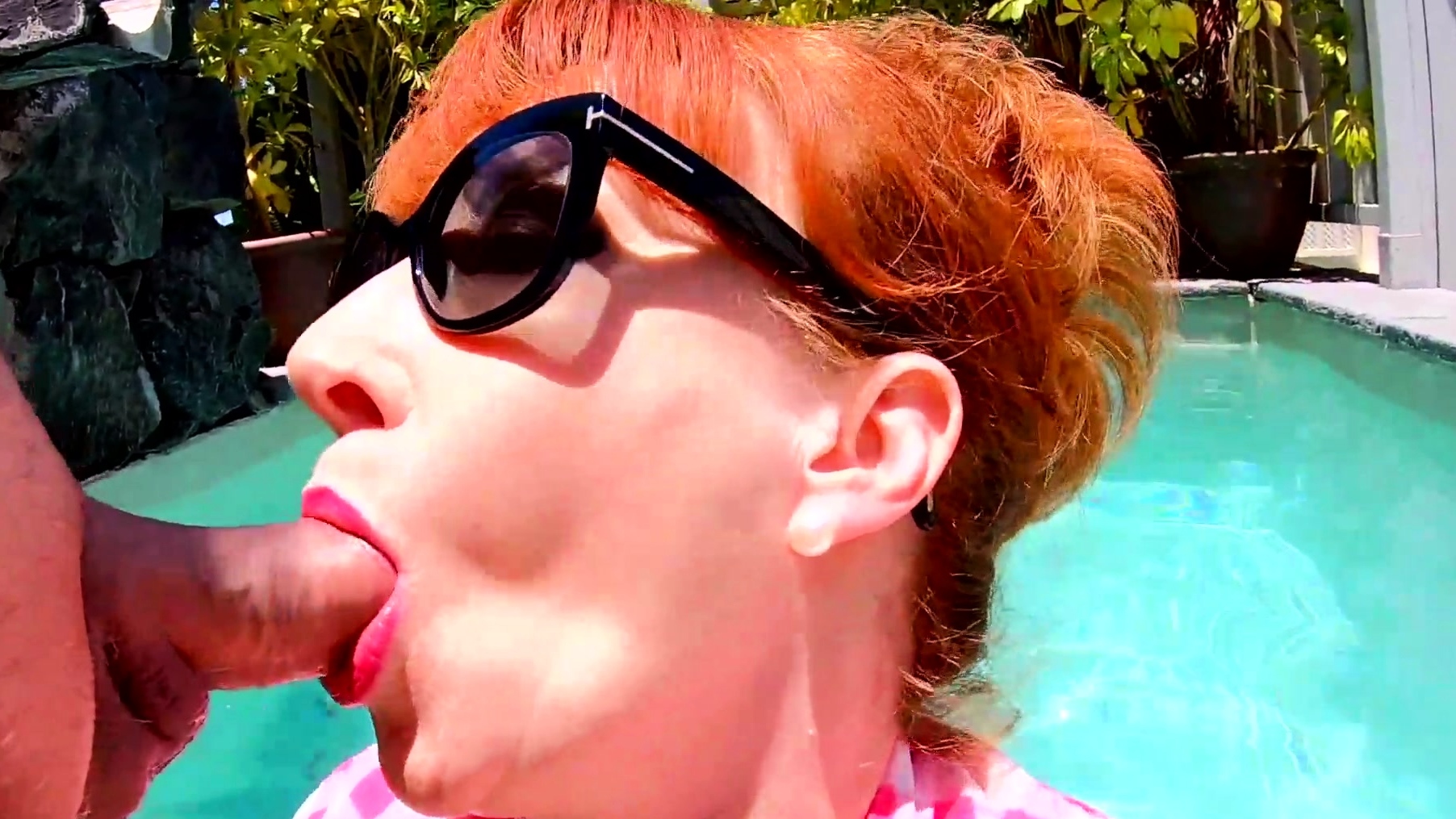 Red XXX masturbating and sucking cock while in the pool