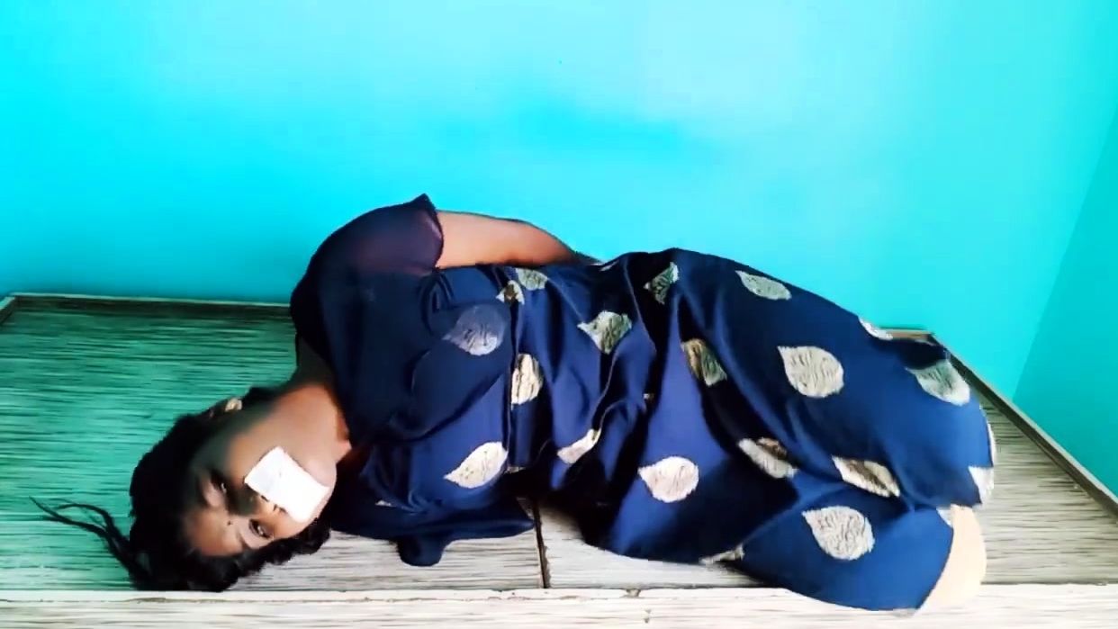 Indian woman hogtied in blue robe