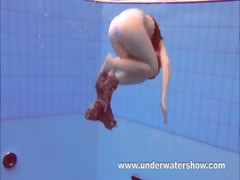 Redheaded Katka playing underwater