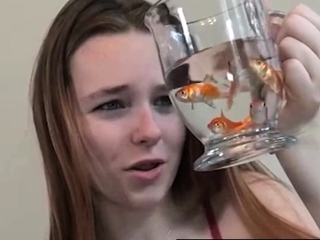 Pretty hungry girl swallows innocent fish – Vore